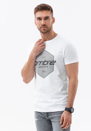 White cotton t-shirt featuring a black geometric graphic with lines and text. Slim fit design, short sleeves, and crew neck.