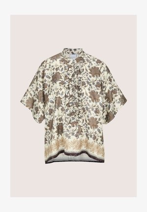 Floral blouse in cream, featuring brown and blue patterns. Ruffled front detail and short sleeves, finished with intricate hemline accents.