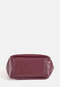 Mauve leather handbag with a rectangular shape, smooth texture, and clean seams. Features a flat bottom and minimalist design.