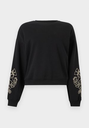Svarte, langermede, avkortede sweatshirt med ribbekantede mansjetter og nederkant, med beige blomsterbroderi på begge underarmer.
