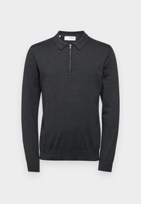 Mörkgrå långärmad polotröja med dragkedja i kragen. Mjukt, texturerat tyg, figursydd design samt ribbade ärmslut och nederkant.