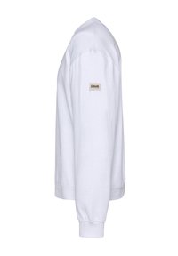 Biała bluza z długim rękawem, z ściągaczami na mankietach oraz małą naszywką z logo na lewym ramieniu. Wykonana z bawełny, z klasycznym dekoltem typu crew neck.