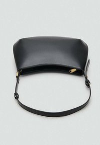 Black leather handbag with a curved top, single adjustable strap, and gold zipper detail. Smooth texture and minimalist design.