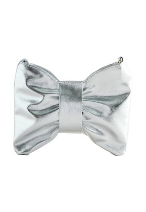 Shiny silver clutch bag shaped like a large bow with a central band and smooth metallic texture on a white background.