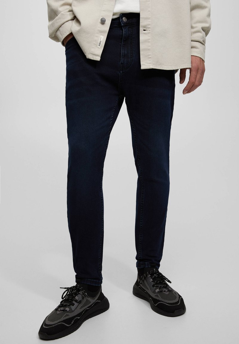 PULL&BEAR SOFT CARROT Jeans Tapered Fit dark blue Zalando.ie