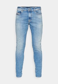 Blå denim skinny jeans med midjehöjd, fem fickor och subtila slitningar på framsidan. Klassisk sömnad och slim fit.