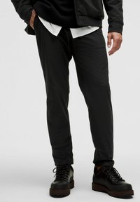 ABC WARPSTREME - Pantalones - black