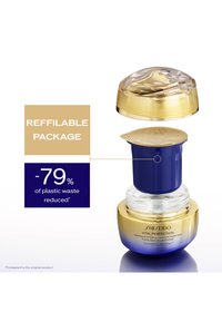 Pot de soin rechargeable avec une section inférieure transparente, une partie supérieure dorée et un accent bleu. Doté d'un bouchon doré sur un couvercle intérieur assorti.