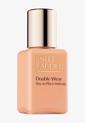 Estee Lauder Double Wear foundationflaske, rektangulær form, mat ferskenfarve, gulddetaljer, uigennemsigtigt materiale med mærkatdetaljer.