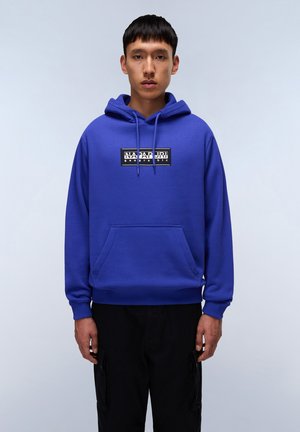 Royal blue hooded sweatshirt made from cotton blend, featuring a front kangaroo pocket and a branded black and white graphic on the chest.