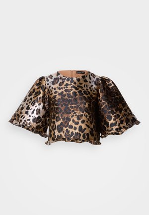 Majica s kratkim rukavima u leopard uzorku u metalik zlatnoj i crnoj boji. Ima lepršave rukave, okrugli izrez i patentni zatvarač na leđima. Mekana tekstura.
