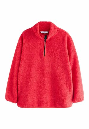Rød fleece-pullover med struktureret stof, lange ærmer, ståkrave og sort halv lynlås foran.