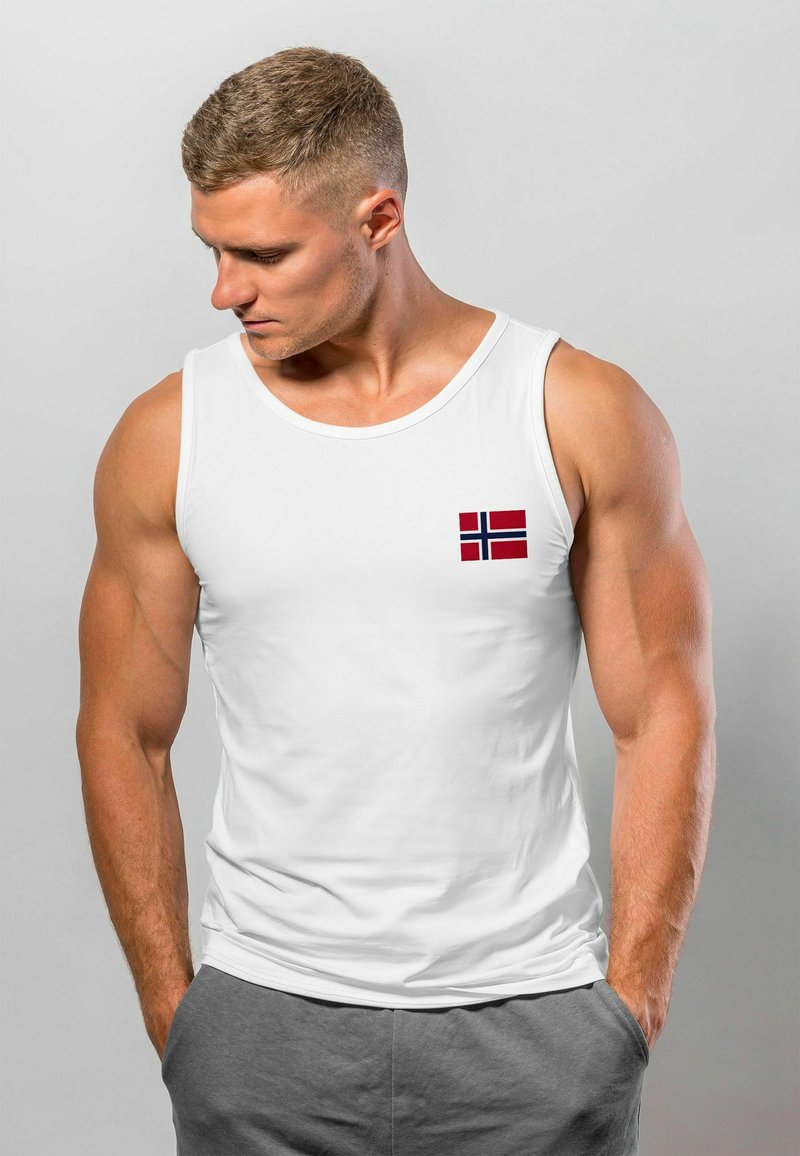 White tank top made of lightweight fabric, featuring a small Norwegian flag design on the left chest. Simple, fitted cut.