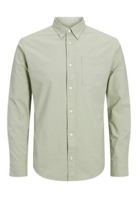 Camicia verde chiaro a maniche lunghe in cotone. Presenta un colletto con bottoni, una tasca frontale e una vestibilità regolare con chiusura a bottoni.