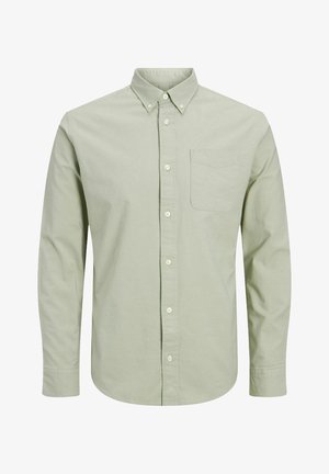 Lichtgroen hemd met lange mouwen gemaakt van katoen. Voorzien van een button-down kraag, een borstzakje en een regular fit met sluitknopen.