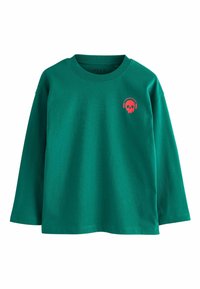 Žalia, ilgomis rankovėmis medvilnės marškinėliai su raudoną kaukolę ikoną su ausinėmis kairėje krūtinės pusėje. Klasikinio apvalaus iškirpimo dizainas.