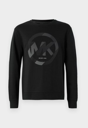Juodas medvilnės džemperis su apvaliu logotipu, kuriame yra „MK“ iš tekstūrinių sidabro atspaudų ir „MICHAEL KORS“ žemiau. Ilgos rankovės ir elastingos rankogaliai.