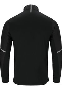 Sort atletisk jakke med høj krave, lange ærmer og refleksdetaljer på skuldrene. Glat tekstur og tætsiddende design.