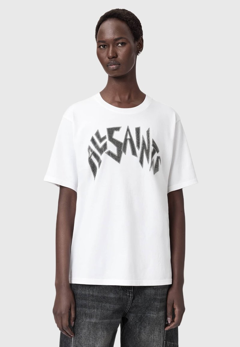 T-shirt bianco a maniche corte con un design grafico nero dalle linee nette. Materiale in cotone con girocollo classico e vestibilità rilassata.
