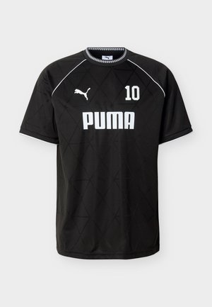 Must must Puma spordisärk valge numbriga 10, rinnal Puma logo, ning kangal peen teemantsilmusmuster, lühikesed varrukad ja ruuduline kraeääris.