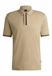 Beige polo shirt with a three-button placket, featuring contrasting brown and white stripes on the collar and sleeves. Logo embroidered.