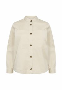 Beige skjorta med ståkrage, två framfickor och bruna knappar. Tillverkad av ett mjukt, lätt tyg.