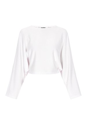 Kort hvid langærmet top lavet af blødt stof med rund halsudskæring og løs pasform. Enkel design, ingen synlige logoer eller mønstre.