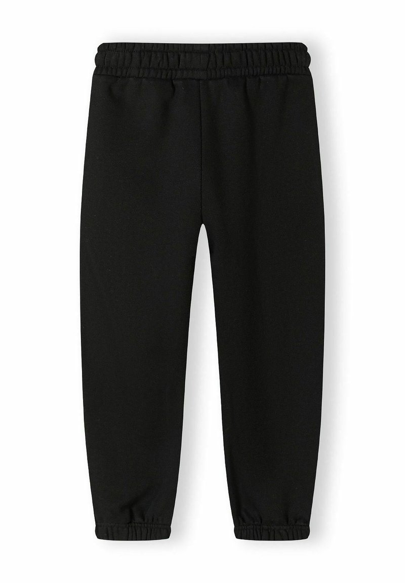 Un pantalon de survêtement noir avec une taille élastique, des jambes cintrées et des ourlets côtelés. Fabriqué en tissu doux avec une texture lisse, sans motifs ni accents.