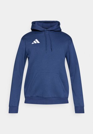 Sudadera azul marino con capucha, bolsillo canguro y logo blanco de Adidas en el pecho. Confeccionada con tela suave y texturizada, y puños ajustados.