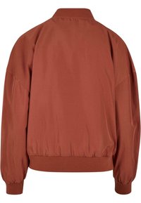 Bomber jacket v rustovej farbe s voľným strihom, ribovaným golierom a elastickými manžetami. Hladká textúra, s jednoduchým dizajnom bez vzorov.