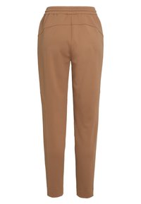 Brown tapered pants with elastic waistband and side pockets, shown from the back on a white background.