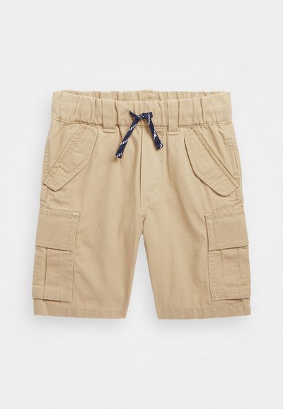 Ljusbeige cargo-shorts med elastisk midja och marinblå dragsko. Har två sidopunkter och två frampocketar. Slät textur.