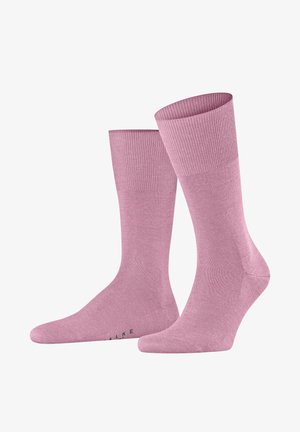 Calzini di cotone rosa con polsini a coste, texture liscia e punta rinforzata. Presentano un logo discreto sulla parte inferiore.