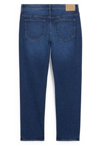 Dark blue denim jeans with a straight cut, featuring two back pockets and a leather label on the waistband. Clean design and sturdy texture.