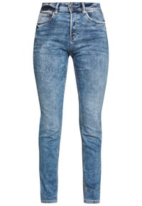 Ljusblå jeans i denim med en åtsittande design, med slitna detaljer, fem fickor och dragkedja med knappstängning.