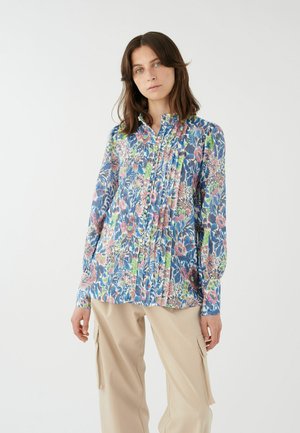 Bluse mit floralem Muster in Blau, Pink und Grün. Mit einem gepflügten Vorderteil, Knopfverschlüssen und einem hohen Kragen. Lange Ärmel mit Manschetten.
