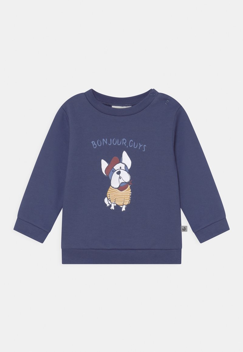 Pull bleu marine à manches longues pour tout-petit avec illustration d'un chien portant une chemise rayée et un béret, et le texte « BONJOUR, GUYS » à l'avant.