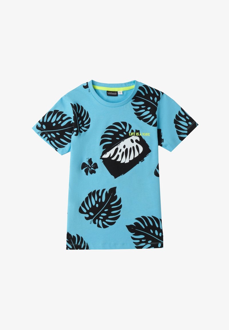 Camiseta de algodón azul con mangas cortas, que presenta grandes patrones de hojas de monstera negras y un texto gráfico que dice "LA VIDA ES UNA OLA" en verde neón.