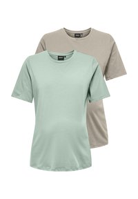 Dos camisetas de manga corta: una en verde menta y otra en beige. Ambas están hechas de algodón suave con un cuello redondo clásico y un ajuste relajado.