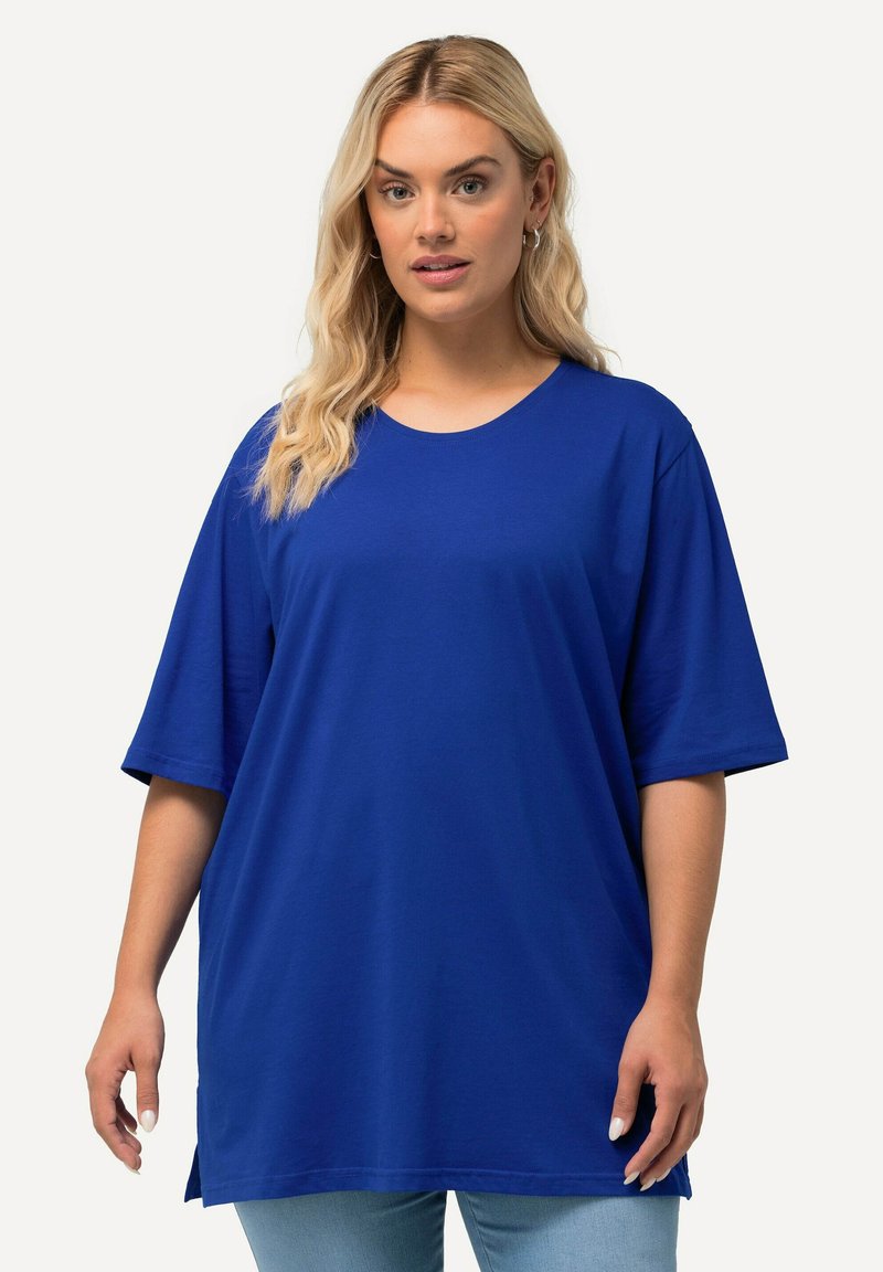 Royal blue oversized t-shirt made of soft cotton, featuring a round neckline and short sleeves, with side slits for added comfort.
