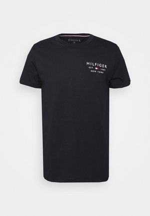 Black short-sleeve t-shirt with small white and red "Hilfiger Est. 1985 New York" logo on the upper left chest area.