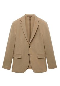 Blazer beige en tissu texturé, avec un col cranté, deux poches avant, une fermeture à un bouton et une poche sur la poitrine.