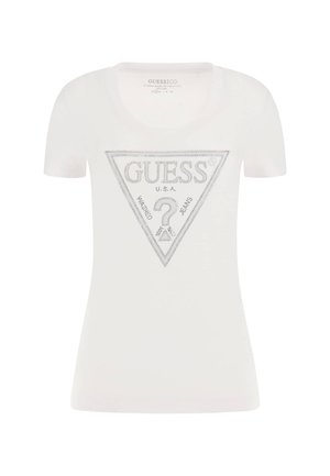 T-shirt blanc à manches courtes en coton, arborant un logo en forme de triangle argenté avec le texte "GUESS" et "U.S.A." en finition brillante.