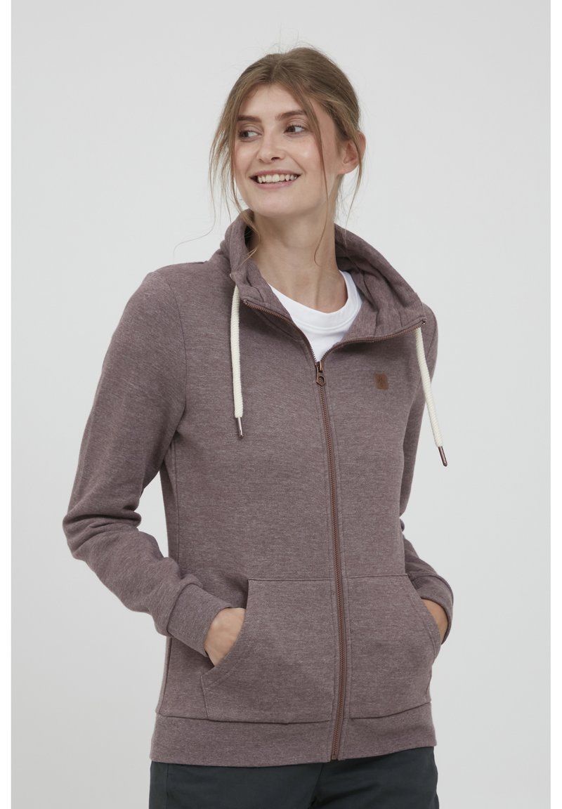 Malva zip-hoodie med dragsko, framfickor och en mjuk textur. Designad med en figurnära passform och ribbade ärmslut.