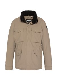 Giacca imbottita color beige con colletto in velluto a coste neri, due tasche sul petto e due tasche laterali; presenta bottoni a scatto e chiusura con zip.