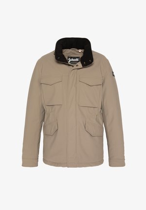 Chaqueta aislante color beige con un cuello de pana negro, dos bolsillos en el pecho y dos bolsillos laterales; cuenta con botones a presión y un cierre de cremallera.