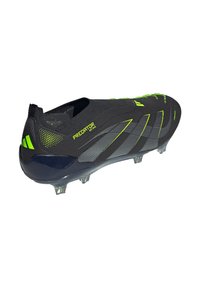 Black and neon green Adidas Predator soccer cleat with molded studs and "PREDATOR EST. 1994" text on the side.