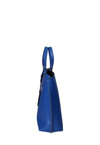 Sac en cuir bleu avec deux anses, forme structurée, texture lisse et détails de couture contrastés le long des bords.