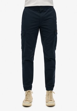 Pantalons cargo bleu marine avec poches latérales, poignets élastiques et taille ajustée. Confectionnés en tissu doux, ils présentent un design décontracté adapté à diverses occasions.