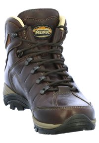 Braune Lederwanderschuhe mit einem hohen Knö Zudem, robuster Schnürsystem, Gummisohle und verstärktem Zehenbereich für Langlebigkeit.
